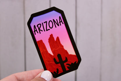 Arizona Landscape State Sticker. Overlook onto Arizona landscape with a stunning sunset gradient. Show your state pride.