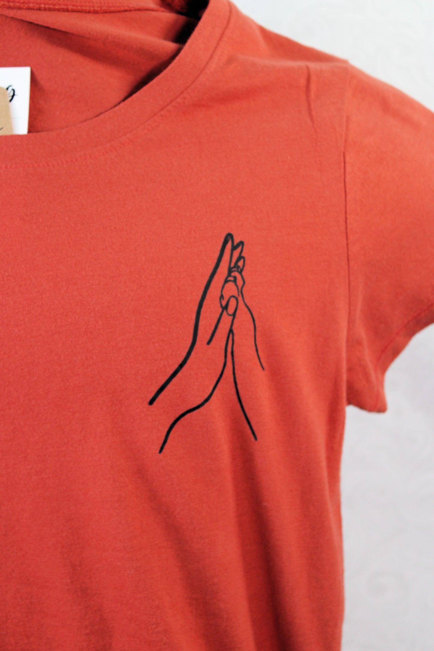 Hand to Paw Connection Tee: Pocket-Sized Design